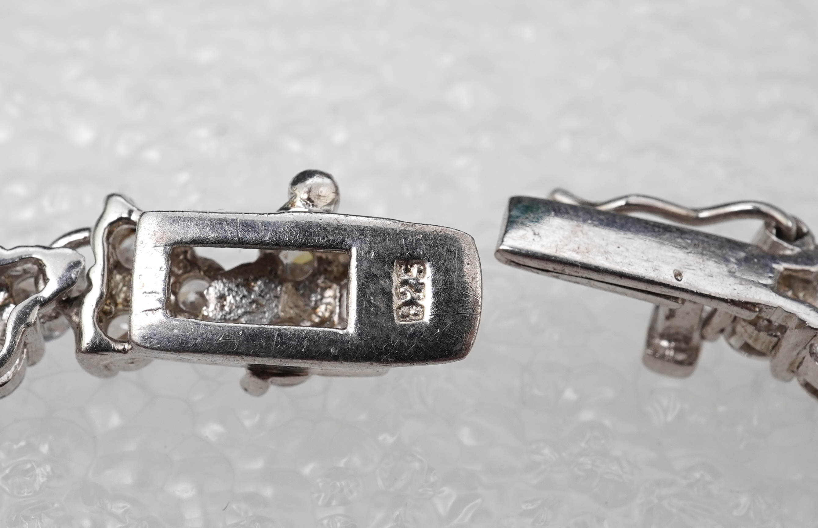 A synthetic sapphire and cubic zirconia necklace and two pendants, the necklace set with oval synthetic sapphires and brilliant-cut and marquise-shaped cubic zirconias, mounted in silver, length 44cm, stamped 925; togeth